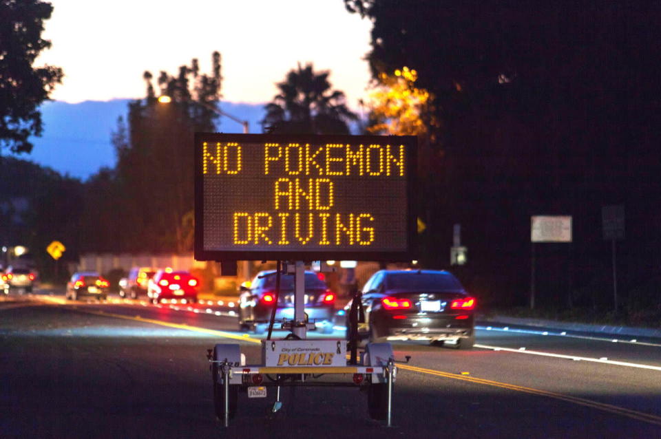 A road sign warns drivers not to play ‘Pokemon Go’ while behind the wheel in Los Angeles, USA