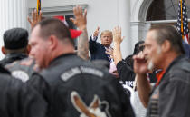 President Donald Trump gives the thumbs-up to members of Bikers for Trump and supporters, Saturday, Aug. 11, 2018, outside the clubhouse of Trump National Golf Club in Bedminster, N.J. (AP Photo/Carolyn Kaster)
