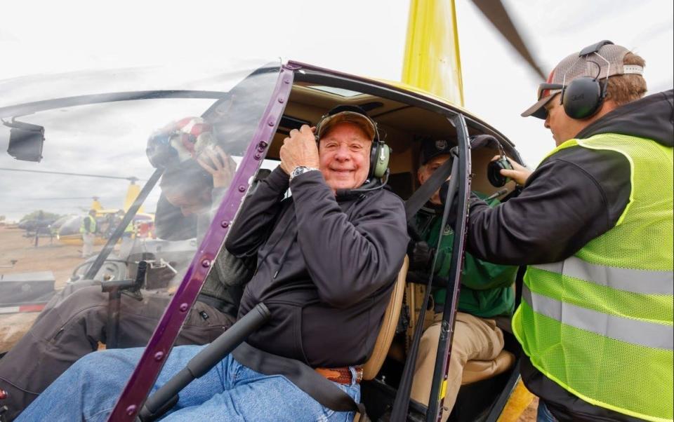 Sgt. First Class Gary Littrell, a Vietnam veteran and Medal of Honor recipient, prepares to go hog hunting in a helicopter at the Circle Bar Ranch in Truscott.