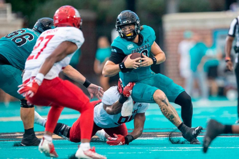 Grayson McCall rushes against Jacksonville State’s Austin Ambush on Saturday. Coastal Carolina University takes on Jacksonville State in the chanticleers first home game of the 2023 football season. Sept. 9, 2023.