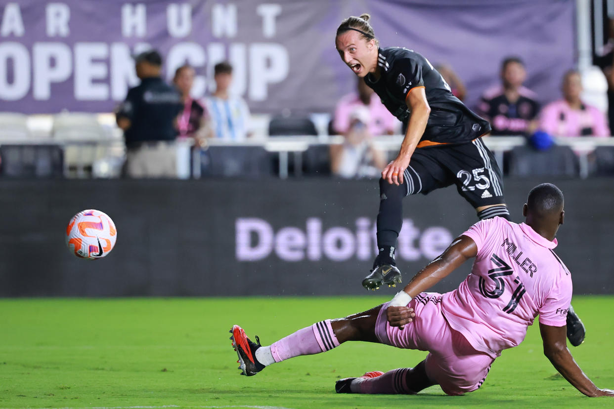 FORT LAUDERDALE, FLORIDA - SEPTEMBER 27: Griffin Dorsey #25 of Houston Dynamo scores a goal in the first half while defended by Kamal Miller #31 of Inter Miami during the 2023 U.S. Open Cup Final at DRV PNK Stadium on September 27, 2023 in Fort Lauderdale, Florida. (Photo by Hector Vivas/Getty Images)