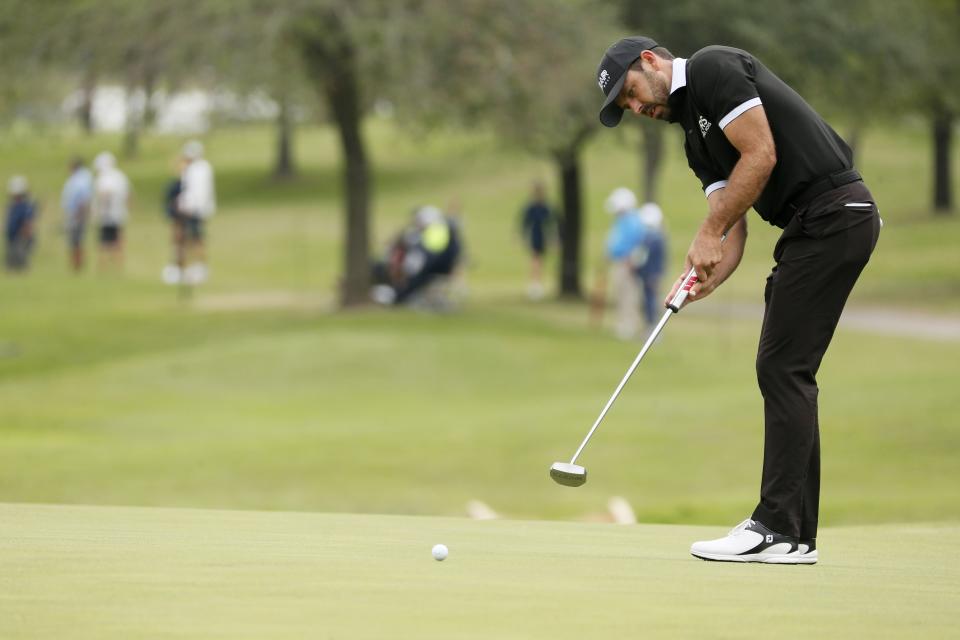 Charl Schwartzel, of South Africa, putts on the first green during the final round of the AT&T Byron Nelson golf tournament in McKinney, Texas, Sunday, May 16, 2021. (AP Photo/Ray Carlin)