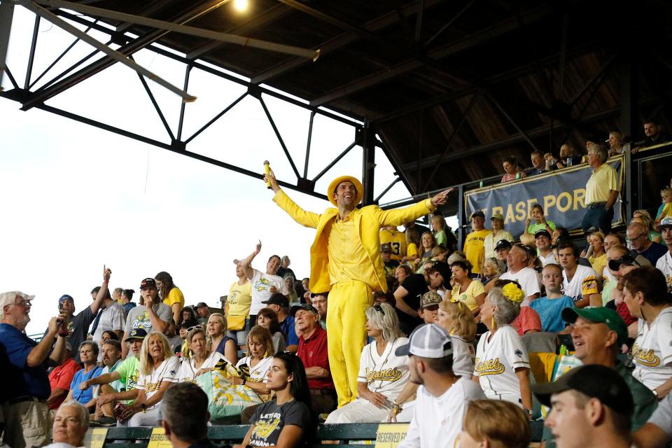 Savannah Bananas owner Jesse Cole keeps the crowd pumped up during a rain delay.