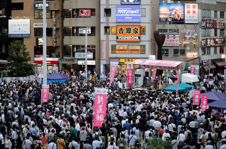 Voters watch Reiwa Shinsengumi's rally for Japan's July 21 upper house election in Tokyo