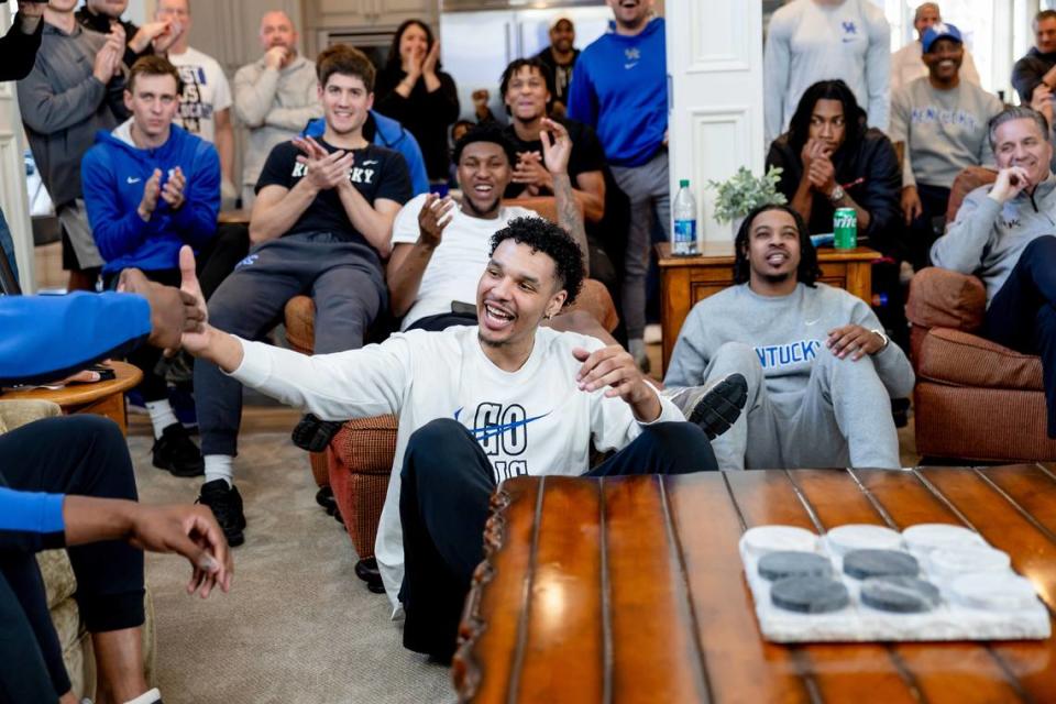 Tre Mitchell reached out to slap hands with fellow Pittsburgh-area native Adou Thiero as John Calipari looked on after Kentucky’s bracket was revealed for the NCAA Tournament. Chet White/UK Athletics