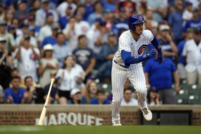 Chicago Cubs center fielder Cody Bellinger drives in a run with a