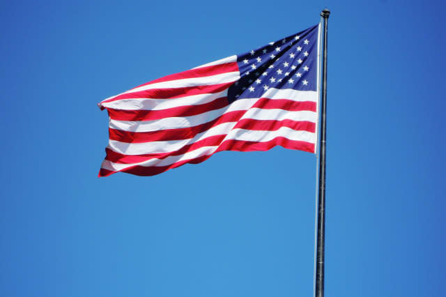 American Flag Against Clear Blue Sky