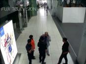 CCTV footage shows Kim Jong-Nam (grey suit) speaking to Malaysian security guards, moments after he was attacked in Kuala Lumpur International Airport on February 13