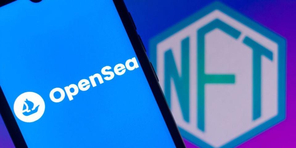 The OpenSea logo seen displayed on a smartphone with the NFT logo in the background.