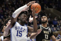 Duke center Mark Williams (15) struggles for the ball with Wake Forest forward Dallas Walton (13) during the second half of an NCAA college basketball game in Durham, N.C., Tuesday, Feb. 15, 2022. (AP Photo/Gerry Broome)