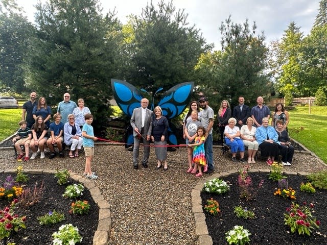 The honored guests at the Sept. 7, 2023, dedication ceremony for the new Butterfly Garden at Silver Park in Alliance were, from left, the Bahler Family, standing and sitting around on the bench they sponsored; Landon Trowbridge (great grandson of Wanda Bahler) holding ribbon; Alliance Mayor Andy Grove and his wife, Sue; Charlie Miller and family; Alliance Parks Director Kim Cox; Alliance Area Chamber of Commerce President Rick Baxter; landscaper Allen Watson; Park Board Commissioner Jennifer Mastroianni; and members of the Town and Country Gardeners Club.