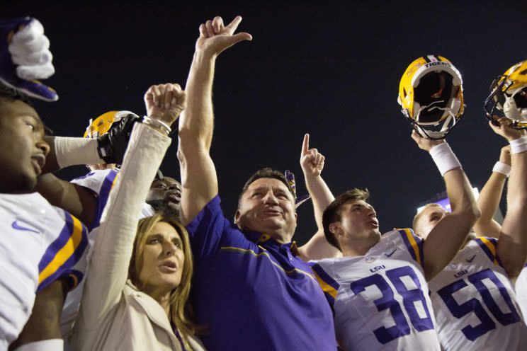 Head coach Ed Orgeron (middle) is serious about protecting his recruiting turf in Louisiana. (AP) 