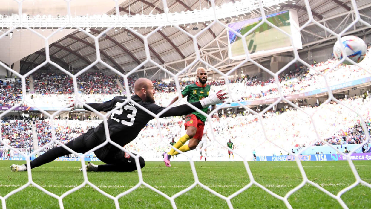 AL WAKRAH, QATAR - NOVEMBER 28: (EDITORS NOTE: In this photo taken from a remote camera from behind the goal) Eric Maxim Choupo-Moting of Cameroon scores their team's third goal past Vanja Milinkovic-Savic of Serbia during the FIFA World Cup Qatar 2022 Group G match between Cameroon and Serbia at Al Janoub Stadium on November 28, 2022 in Al Wakrah, Qatar. (Photo by Stu Forster/Getty Images)