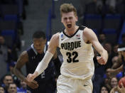 <p>Purdue’s Matt Haarms celebrates a scored basket as Old Dominion’s Justice Kithcart (2) follows at left during the second half of a first round menâs college basketball game in the NCAA Tournament, Thursday, March 21, 2019, in Hartford, Conn. Purdue won 61-48. (AP Photo/Elise Amendola) </p>