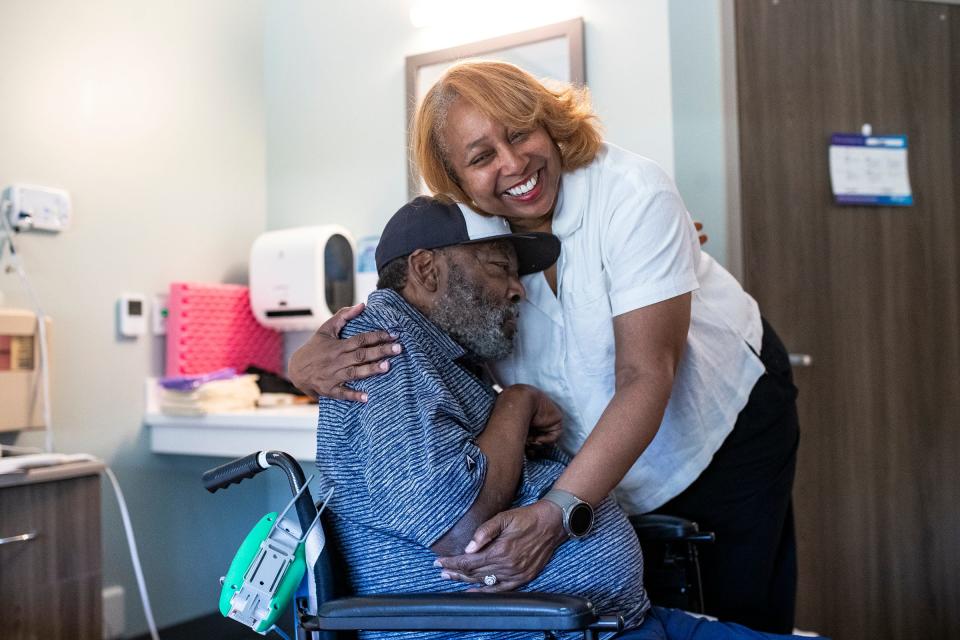 Gigi Lemon, right, hugs her husband, Chet Lemon, during a visit at Encompass Health Rehabilitation Hospital in Clermont, Fla., on Thursday, May 23, 2024.