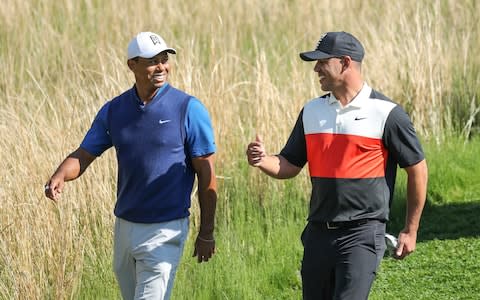 Tiger Woods of the United States walks off the 13th tee with his playing partner Brooks Koepka of the United States during the first round of the 2019 PGA Championship  - Credit: GETTY IMAGES