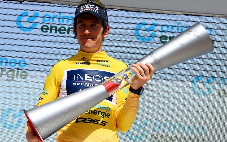 Geraint Thomas of The United Kingdom and Team INEOS Grenadiers celebrates winning the yellow leader jersey on the podium ceremony after the 85th Tour de Suisse 2022 - Tim de Waele/Getty Images