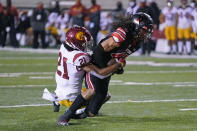 Utah wide receiver Samson Nacua, right, scores against Southern California safety Isaiah Pola-Mao (21) during the first half of an NCAA college football game Saturday, Nov. 21, 2020, in Salt Lake City. (AP Photo/Rick Bowmer)