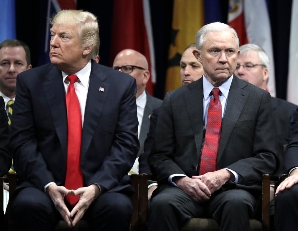 In this Dec. 15, 2017, file photo, President Donald Trump and Attorney General Jeff Sessions attend the FBI National Academy graduation ceremony in Quantico, Va. Sessions is part of a crowded GOP primary field competing to challenge U.S. Sen Doug Jones for the seat Sessions held for 20 years before becoming Trump's first attorney general. Sessions' recusal from the Russia inquiry prompted blistering public criticism from Trump, who eventually asked him to resign as attorney general. (AP Photo/Evan Vucci, File)