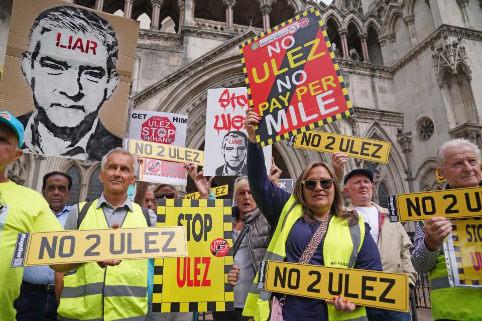 People demonstrate outside the High Court, central London, where five Conservative-led councils are challenging Mayor of London Sadiq Khan's intention to expand London's ultra low emission zone (Ulez). The outer-London boroughs of Bexley, Bromley, Harrow and Hillingdon along with Surrey County Council launched legal action in February over the proposed extension of Ulez beyond the North and South Circular roads. Picture date: Tuesday July 4, 2023.