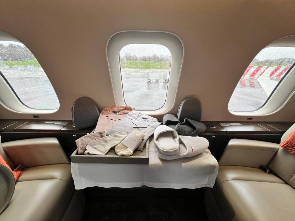 Slippers and pyjamas laid out on a VistaJet Bombardier Global 7500