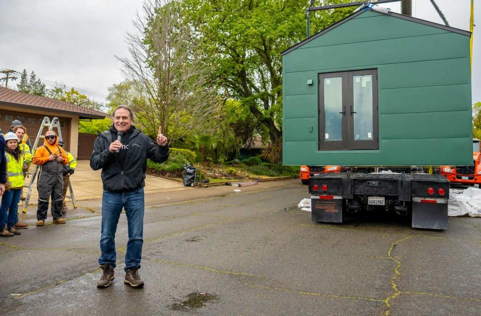 Mike McNamara, the CEO of Samara, presents the ADU that will be dropped into the backyard of a residence located at 6040 13th Street on Thursday.