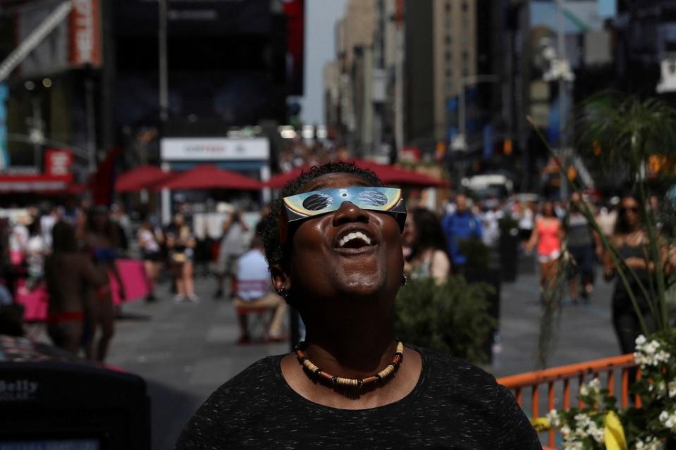 A forecast shows clearer skies in New York City might make staying in the Big Apple a good place to view the spectacle. REUTERS