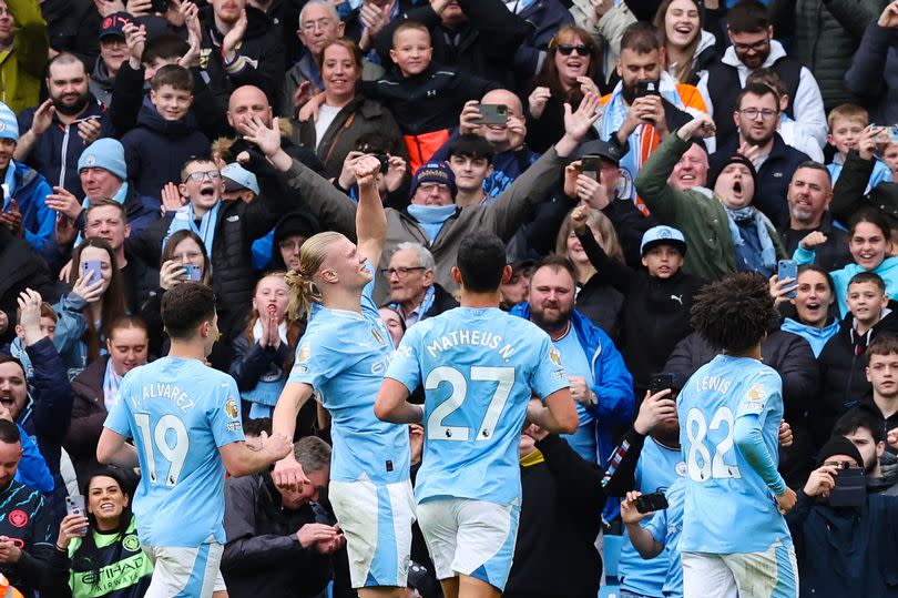 Manchester City's players celebrate after Erling Haaland scored against Luton Town.