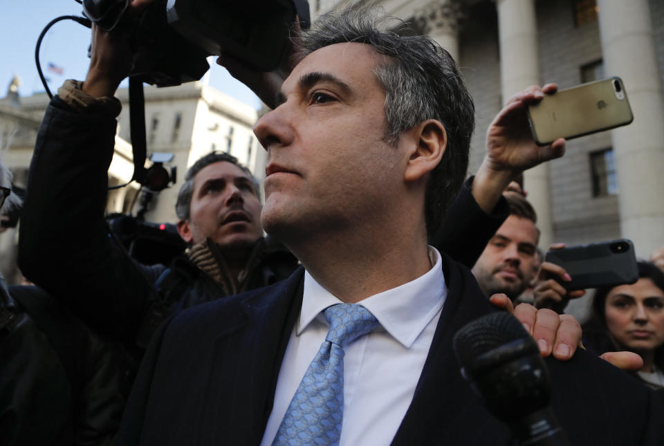 Michael Cohen walks out of federal court, Thursday, Nov. 29, 2018, in New York, after pleading guilty to lying to Congress about work he did on an aborted project to build a Trump Tower in Russia. Cohen, President Donald Trumps former lawyer, told the judge he lied about the timing of the negotiations and other details to be consistent with Trump's "political message." (AP Photo/Julie Jacobson)
