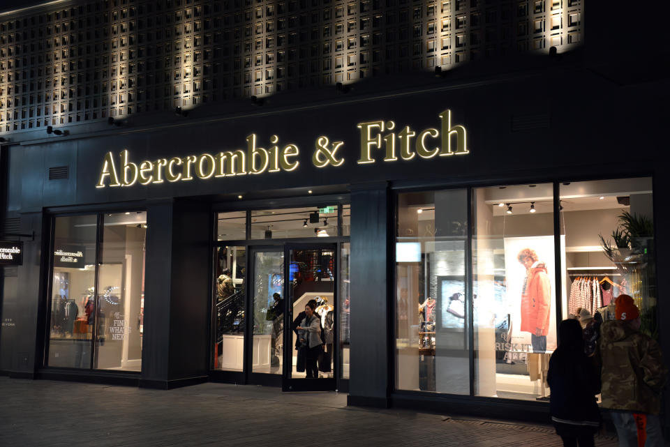 Beijing, China - November 11, 2017:  People shop at night at the Abercrombie & Fitch, an American retailer, in the Sanlitun district known for its international chain stores.