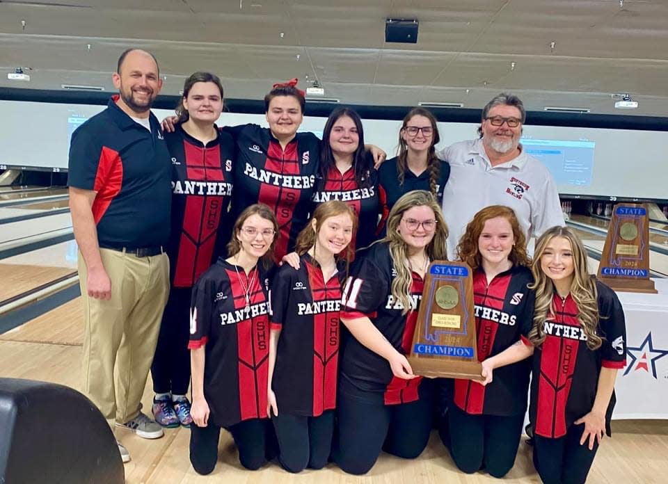 Southside girls bowling pose with the Blue Map trophy after winning the AHSAA Class 1A-5A state bowling championship in Mobile on Friday, Feb. 2, 2023.