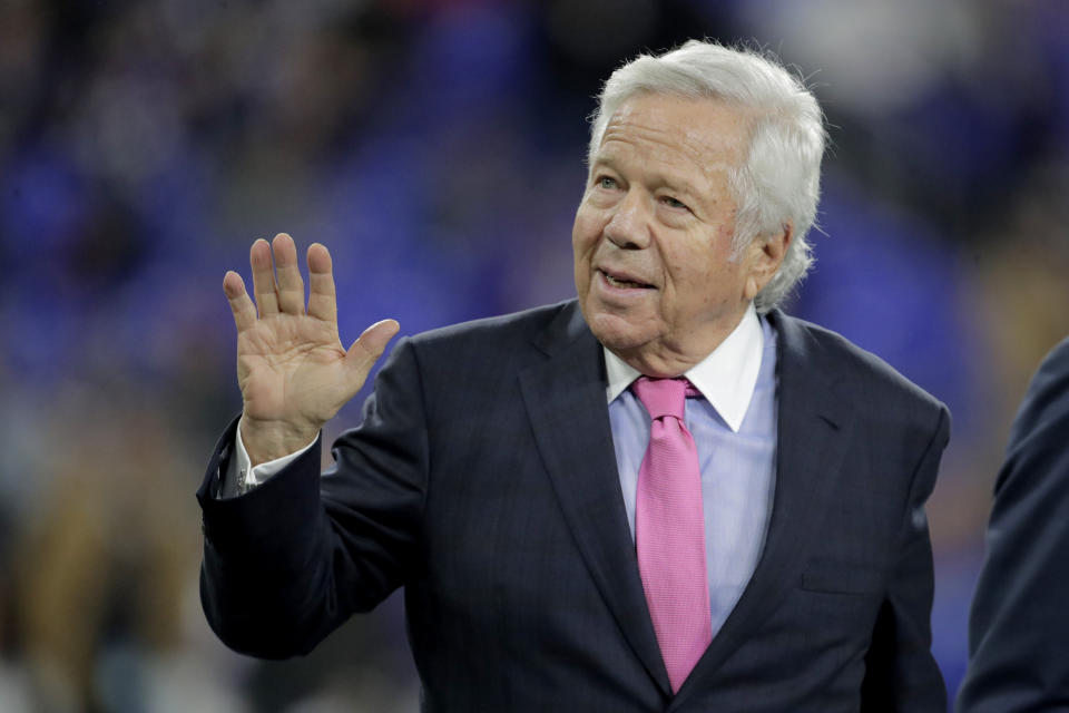 FILE - In this Nov. 3, 2019, file photo, New England Patriots owner Robert Kraft waves to fans as he walks on the field prior to the team's NFL football game against the Baltimore Ravens in Baltimore. Florida prosecutors will try to save their prostitution solicitation case against Kraft when they argue before an appellate court Tuesday, June 30, 2020, that his rights weren't violated when police secretly video recorded him allegedly paying for sex at a massage parlor. (AP Photo/Julio Cortez, File)