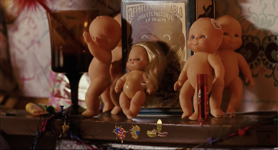 A bunch of kewpie dolls on Juno's shelf