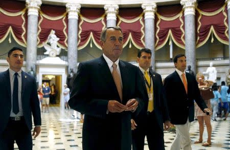 Speaker of the House John Boehner walks to the House Chamber where members of congress were voting on a package of trade bills in the U.S. Capitol in Washington June 12, 2015. REUTERS/Kevin Lamarque