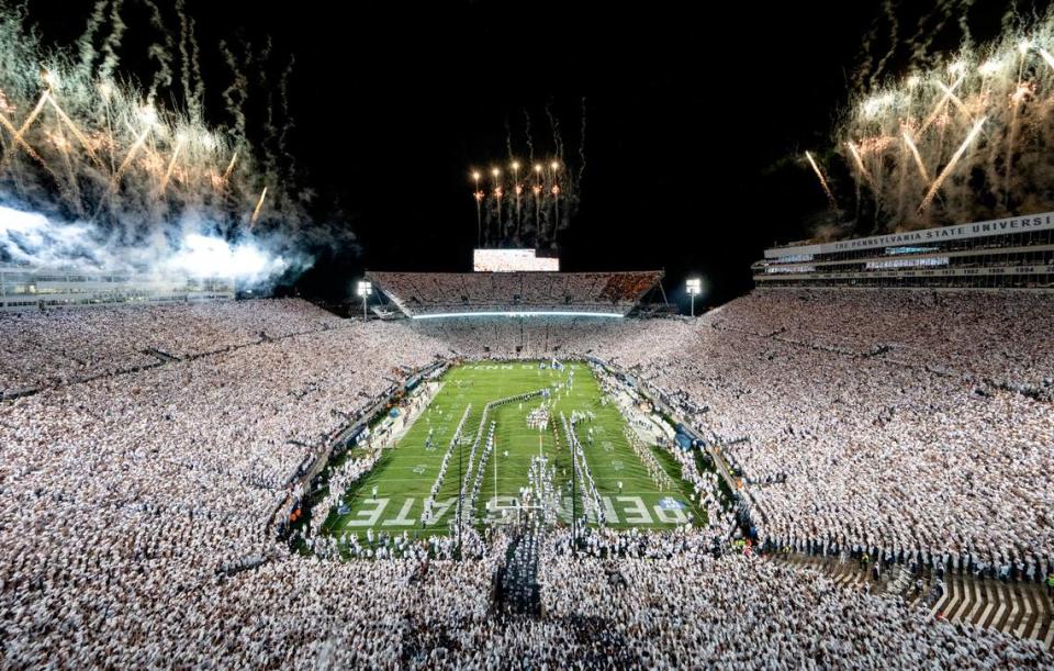 The Penn State football team runs onto the field for the White Out game against Minnesota on Saturday, Oct. 22, 2022 at Beaver Stadium.