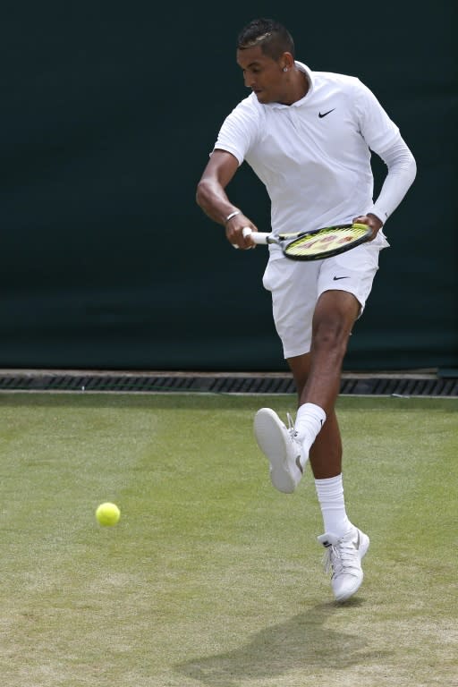 Australia's Nick Kyrgios kicks at a ball during a point against France's Richard Gasquet at Wimbledon on July 6, 2015