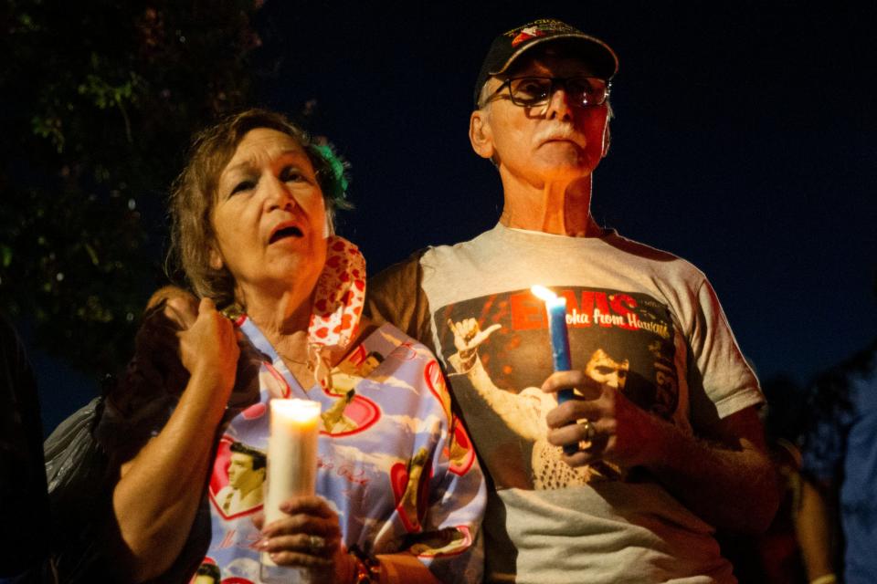 Mary Alice Lopez sings along to Elvis Presley’s music as she and her husband Jaime Lopez, from San Antonio, Texas, hold their candles in front of Graceland during the “Candlelight Vigil” as part of Elvis Week 2023 in Memphis, Tenn., on Tuesday, August 15, 2023. Mary Alice Lopez has come to the vigil 43 times and Jaime Lopez has been 35 times. “The love, the kindness and the wish the world would be this way with everyone loving each other with kindness and harmony,” Lopez said as to why she wants to come back to the event each year. “Elvis personifies all the beautiful things in people and brings inspiration to all of us. He is love personified.”