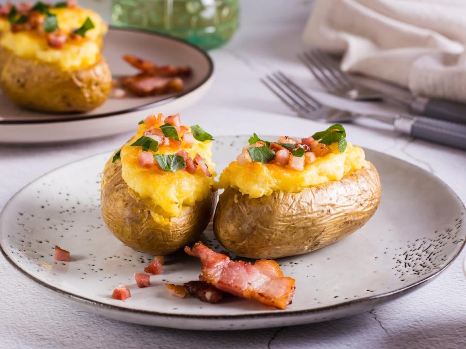 Cheesy and bacon-filled stuffed potatoes, crispy and delicious from the air fryer (Getty)