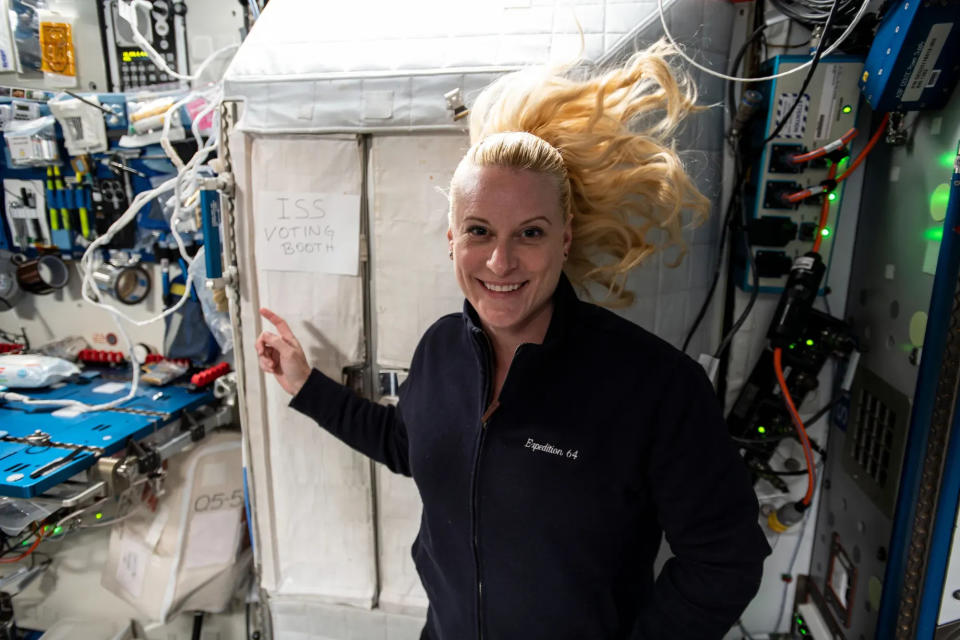 NASA astronaut Kate Rubins points to the International Space Station’s “voting booth” where she cast her vote from space in 2020. That was Rubins’ second time to vote from low-Earth orbit, having cast her first vote from space in 2016.