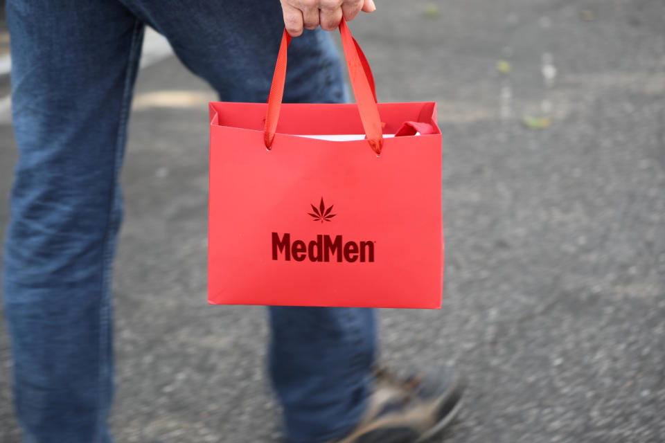 <p>A customer walks out of the MedMen store with recreational marijuana in West Hollywood, Calif., Jan. 2, 2018. (Photo: Lucy Nicholson/Reuters) </p>