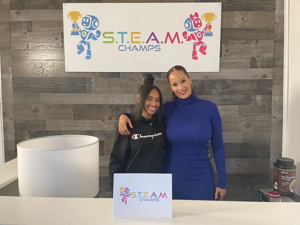 Sanaya Butler (left), an intern at S.T.E.A.M. Champs and the niece of its founder, with her aunt Niesha Butler. (Photo: TheGrio)