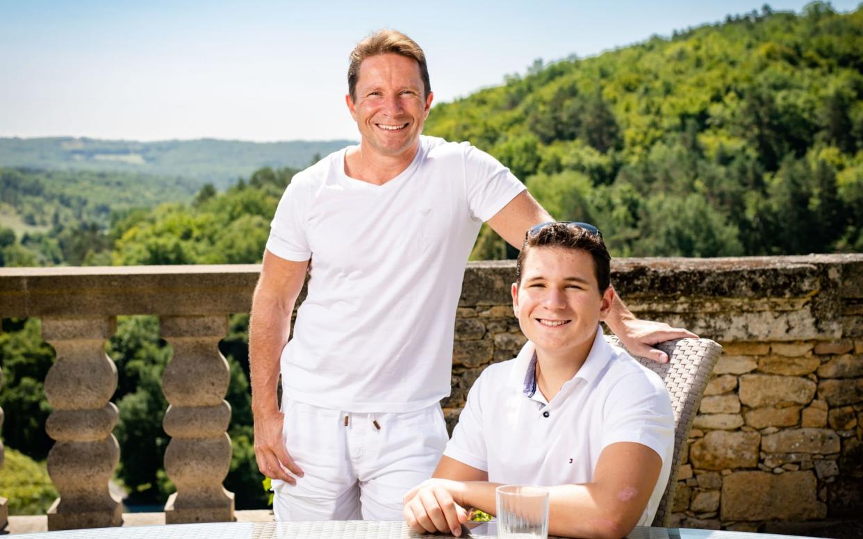 Millionaire entrepreneur Simon Dolan, left, with his son Bowie at their holiday chateau in the Dordogne, France - John Nguyen/JNVisuals