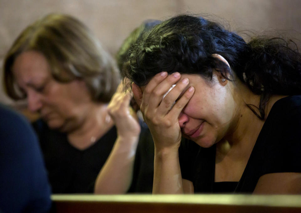 Coptic Christians grieve during prayers for the departed, remembering the victims of EgyptAir flight 804 at Al-Boutrossiya Church, at the main Coptic Cathedral complex, in Cairo, Egypt, Sunday, May 22, 2016. (AP Photo/Amr Nabil)