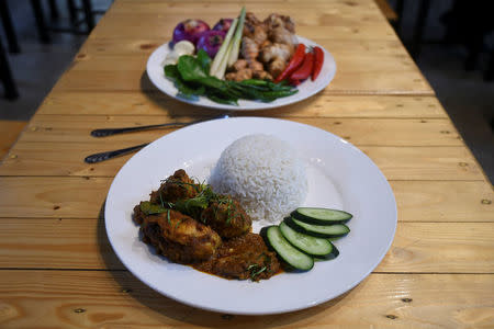 A plate of chicken rendang is pictured at a restaurant in Cyberjaya, Selangor, Malaysia April 4, 2018. REUTERS/Stringer