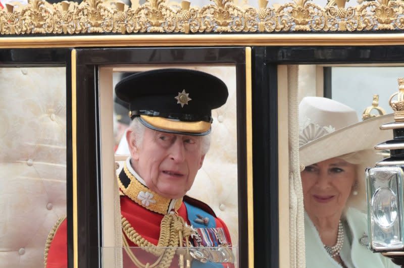 King Charles III and Queen Camilla travel in a Royal carriage at the annual "Trooping the Colour" on The Mall in London on Saturday, June 15, 2024. The ceremony happens annually and dates back to the era of King Charles II. Photo by Hugo Philpott/UPI