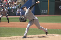 New York Yankees starting pitcher Jordan Montgomery delivers against the Cleveland Guardians during the first inning of a baseball game in Cleveland, Sunday, July 3, 2022. (AP Photo/Phil Long)