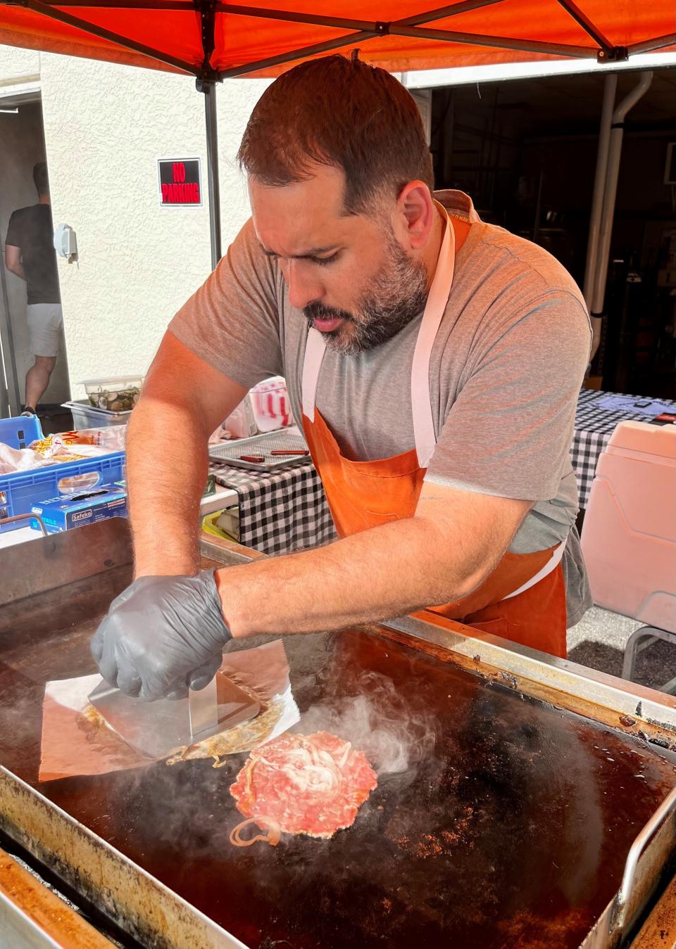 Kyle Cravo fires up his griddle to serve smash burgers at pop-ups around the area.