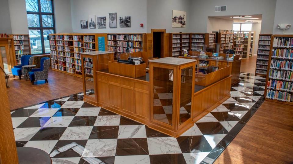 A marble-look flooring was installed at the main entrance of Louis Latzer Library in Highland reminiscent of the original black and white tile.