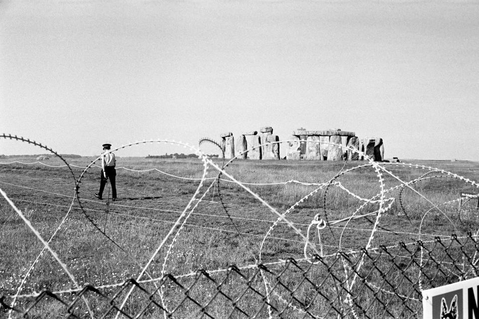 Barbed wire preventing people from reaching Stonehenge in 1985 after a pop festival was banned