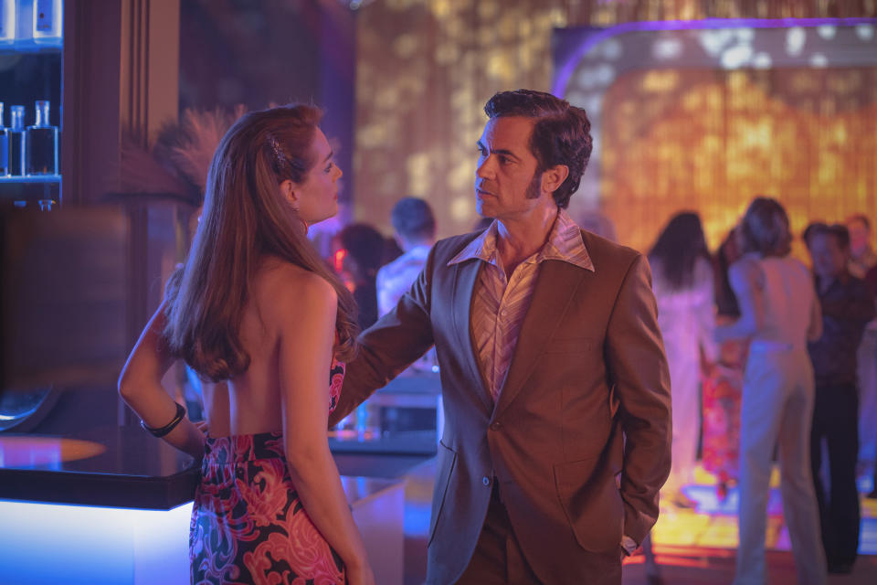 This image released by MGM+ shows Laura Gordon, left, and Danny Pino in a scene from "Hotel Cocaine." (Carlos Rodriguez/MGM+ via AP)